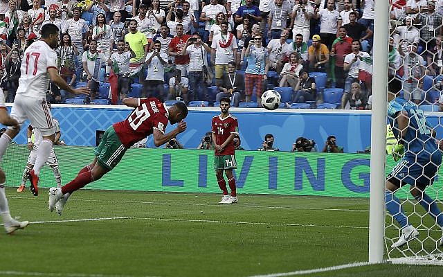 Morocco's Aziz Bouhaddouz, 20, scores an own goal during the group B match between Morocco and Iran at the 2018 soccer World Cup in the St. Petersburg Stadium in St. Petersburg, Russia, Friday, June 15, 2018. (AP Photo/Themba Hadebe)