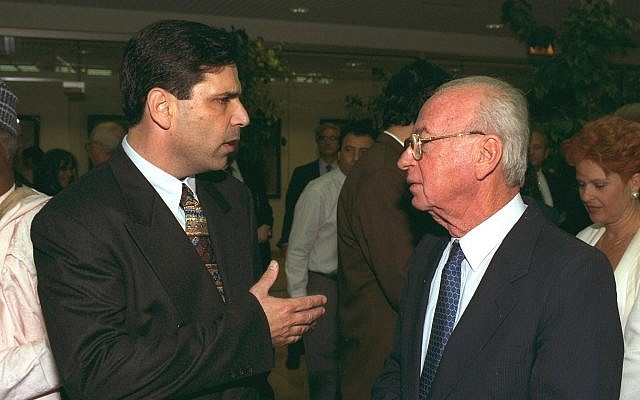 Gonen Segev (L) speaks with then-prime minister Yitzhak Rabin during a conference in Jerusalem. (Government Press Office)