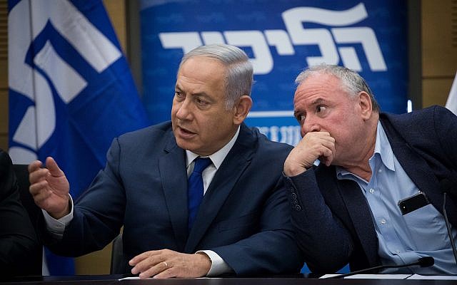 Prime Minister Benjamin Netanyahu and coalition chairman David Amsalem at a Likud party faction meeting at the Knesset, on June 25, 2018. (Yonatan Sindel/Flash90)