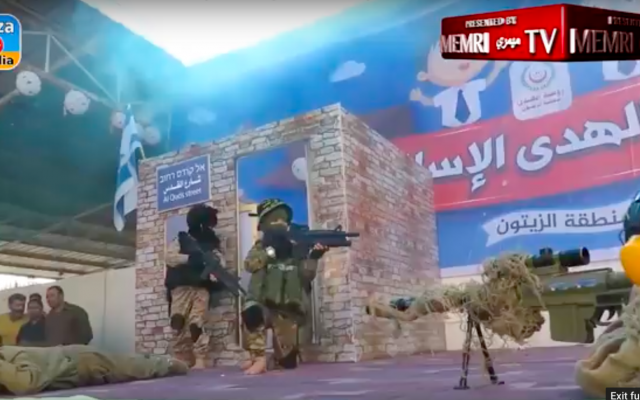 Palestinian children at the Al-Hoda kindergarten perform a play about killing an IDF soldier and taking a civilian hostage on May 13, 2018. (MEMRI, courtesy)