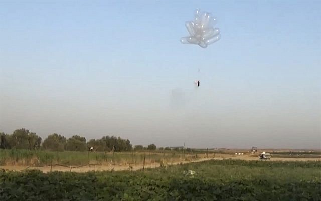 Incendiary balloons being launched into Israel from the Gaza Strip in May 2018. (Screen capture: Quds news)
