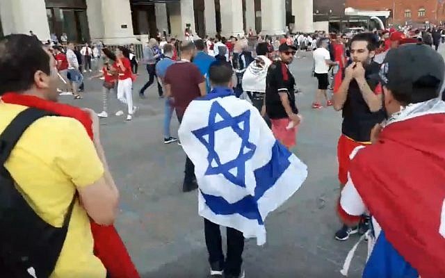 An Israeli man is heckled by Tunisian soccer fans in Moscow, June 21, 2018 (Facebook video screenshot)