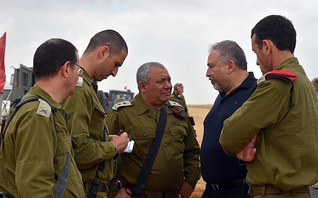Illustrative: Defense Minister Avigdor Liberman, center-right, meets with senior officers in the IDF Southern Command, including IDF chief Gadi Eisenkot, center, and Maj. Gen. Herzl Halevi, right, on June 12, 2018. (Ariel Hermoni/Defense Ministry)