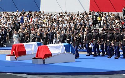 French Republican Guards arrive to carry the coffins of former French politician and Holocaust survivor Simone Veil and her husband Antoine Veil to the Pantheon in Paris on July 1, 2018 during the burial ceremony. (AFP Photo/Pool/Ludovic Marin)