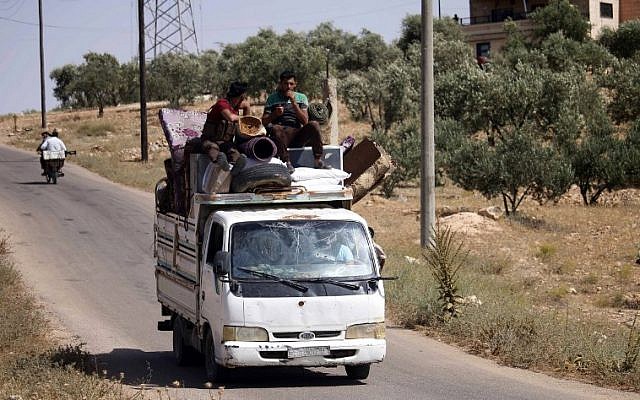 Displaced Syrians flee from government forces' bombardment on rebel-held areas of the embattled southern city of Daraa on July 3, 2018. (AFP/Mohamad ABAZEED)