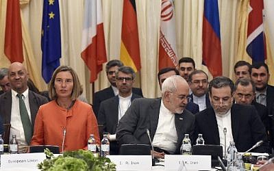 European Union High Representative for Foreign Affairs Federica Mogherini (L); Iranian Minister of Foreign Affairs Mohammad Javad Zarif (C) and political deputy at the Ministry of Foreign Affairs of Iran Abbas Araghchi take part in a Comprehensive Plan of Action (JCPOA) ministerial meeting on the Iran nuclear deal on July 6, 2018 in Vienna, Austria. (AFP/APA/Hans Punz)