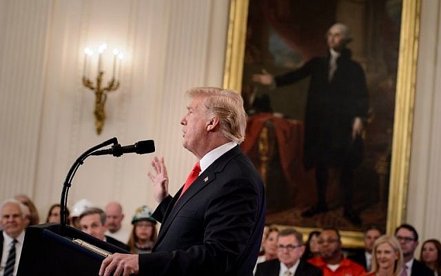 US President Donald Trump addresses the Pledge to America's Workers event at the White House in Washington, DC, beneath a portrait of the first US president George Washington.  (AFP/ Brendan Smialowski)