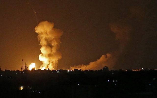 A picture taken on July 20, 2018 shows explosions from Israeli bombardment in Khan Yunis in the southern Gaza Strip. Israeli aircraft and tanks hit targets across the Gaza Strip on July 20 after shots were fired at troops on the border, the army said, with Hamas reporting several members of its military wing killed in the latest flare-up in months of tensions.( AFP PHOTO / SAID KHATIB)