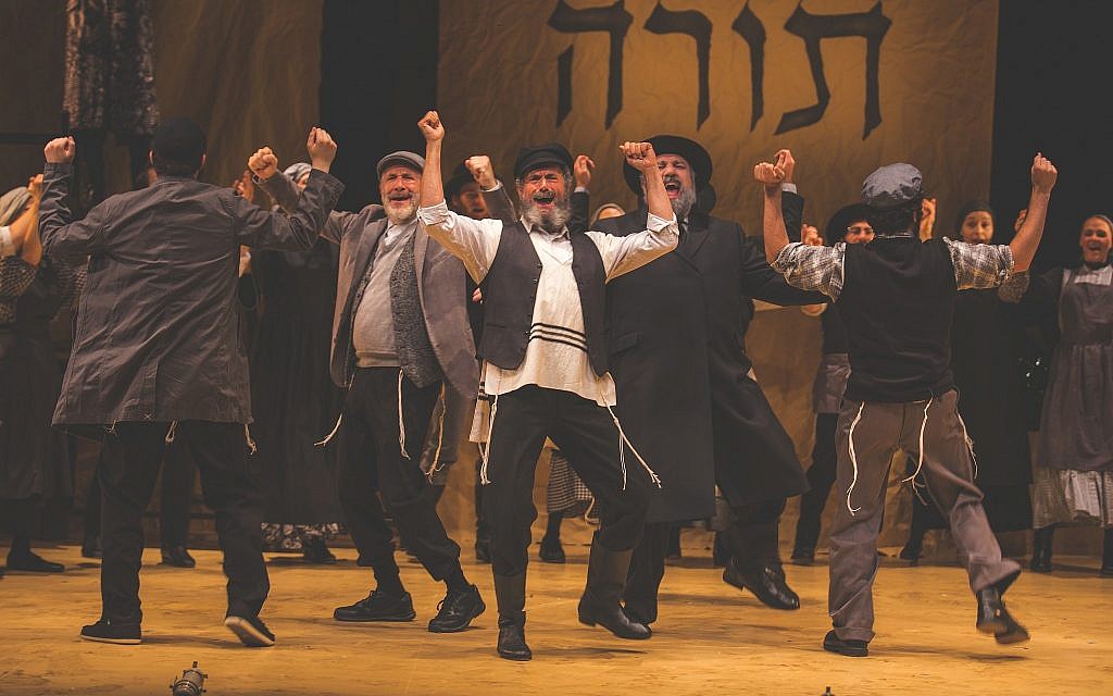 Steven Skybell as Tevye and the ensemble sing 'Tradition' during the National Yiddish Theatre Folksbiene's production of 'Fiddler on the Roof.' (Victor Nechay/ ProperPix.com)