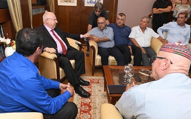 President Reuven Rivlin (L) meeting with Druze community leaders at his residence in Jerusalem on July 29, 2018. (Mark Neiman/ GPO)