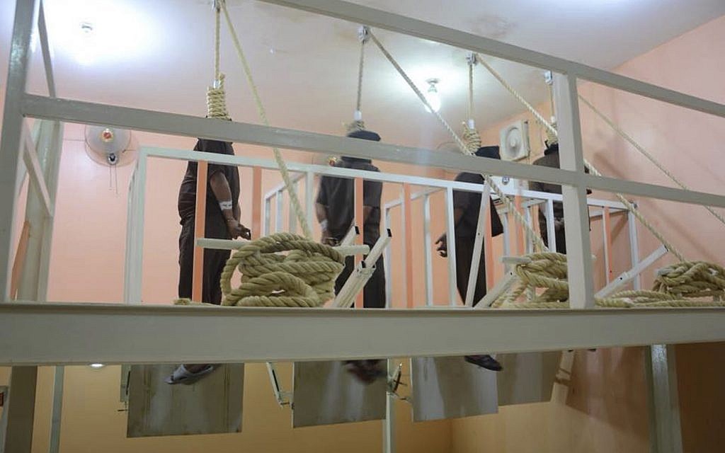 This photo released by Iraq's Ministry of Justice June 29, 2018, shows four men hanging in the gallows in Iraq. (Iraq Ministry of Justice via AP)