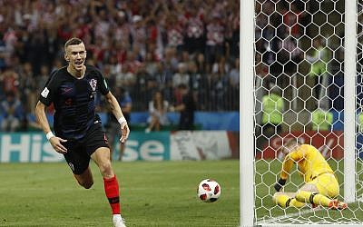 Croatia's Ivan Perisic celebrates after scoring his side's first goal during the semifinal match between Croatia and England at the 2018 soccer World Cup in the Luzhniki Stadium in Moscow, Russia, Wednesday, July 11, 2018. (AP Photo/Alastair Grant)