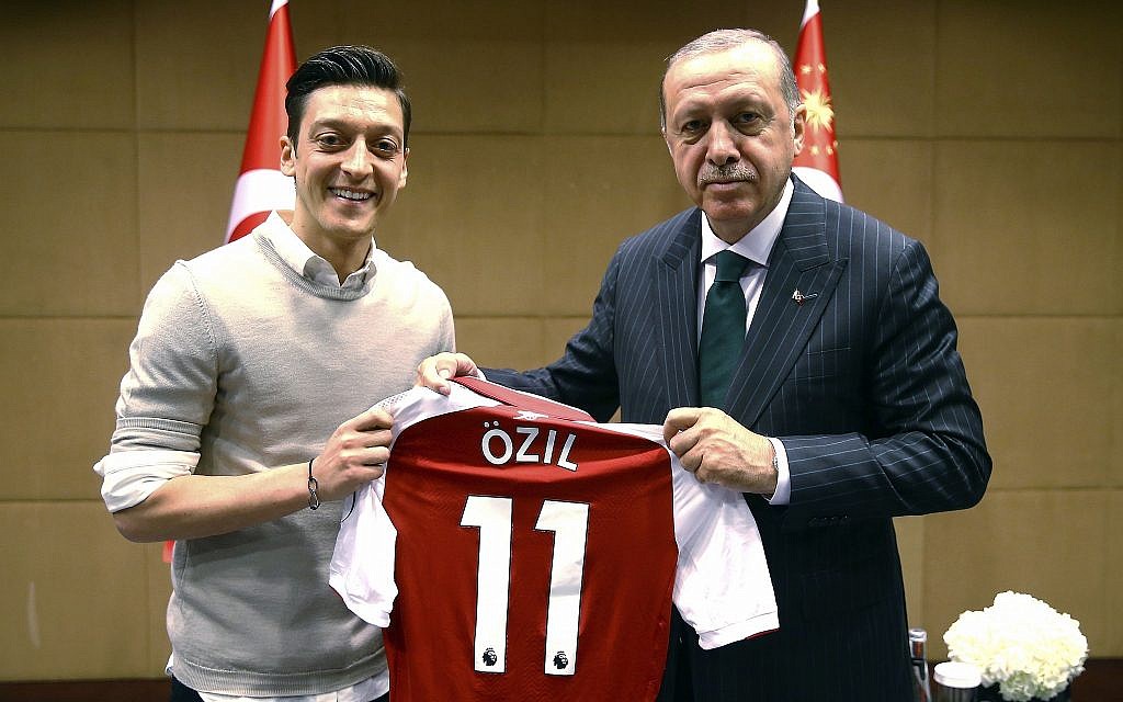 In this photo taken on Sunday, May 13, 2018, Turkey's President Recep Tayyip Erdogan, right, poses for a photo with Turkish-German Arsenal soccer player Mesut Ozil in London. Erdogan started a three-day visit to Britain on Sunday by praising the country as "an ally and a strategic partner, but also a real friend." (Presidential Press Service/Pool via AP)