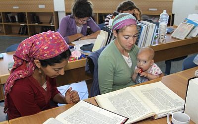 Illustrative: Jewish Orthodox women study Talmud at Kibbutz of Migdal Oz religious study seminary on May 23, 2013. (FLASH90 / Gershon Elinson)