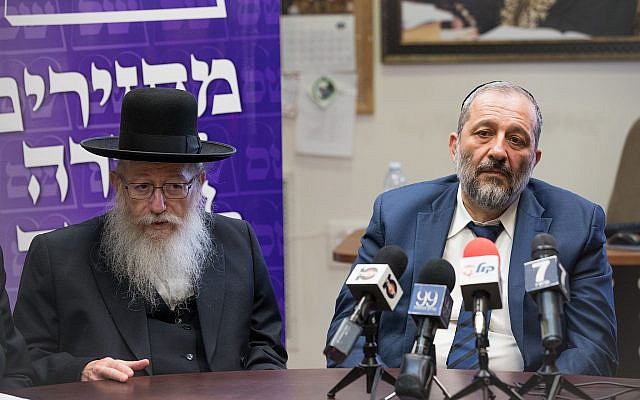 Leader of the ‘Shas’ party Interior Minister Aryeh Deri, right, with leader of the United Torah Judaism party Deputy Health Minister Yaakov Litzman during a joint party meeting at the Knesset, in Jerusalem, June 19, 2017. (Yonatan Sindel/Flash90)