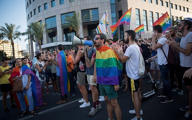 Members of the LGBT community and supporters participate in a demonstration against a Knesset bill amendment denying surrogacy for same-sex couples, in Tel Aviv on July 18, 2018. (Miriam Alster/Flash90)