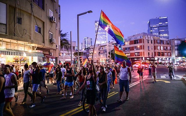 Members of the LGBT community and supporters participate in a demonstration against a Knesset bill amendment denying surrogacy for same-sex couples, Tel Aviv on July 19, 2018 (Tomer Neuberg/Flash90)