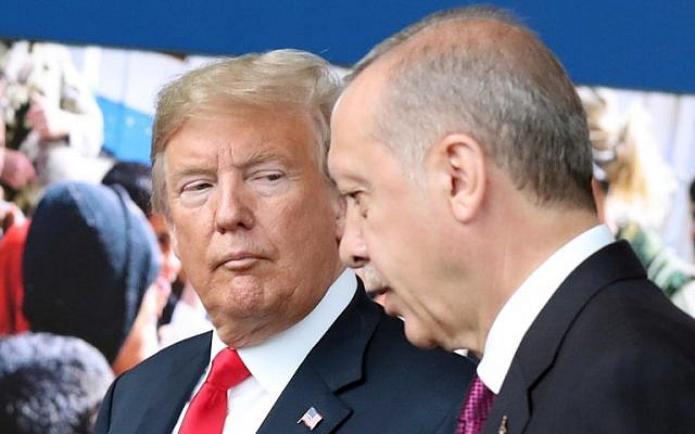 In this file photo taken on July 11, 2018, US President Donald Trump (L) speaks with Turkey's President Recep Tayyip Erdogan (R) as they arrive for a NATO summit at NATO headquarters in Brussels. (AFP Photo/Pool/Tatyana Zenkovich)
