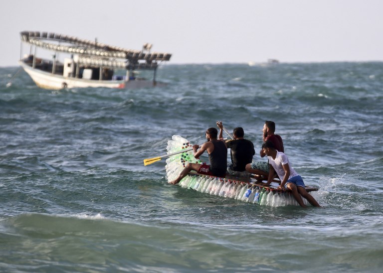 Gaza fisherman battles poverty with plastic bottle boat