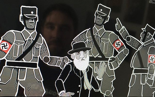Founder and game designer at Paint Bucket Games Joerg Friedrich is reflected in a screen displaying a screenshot of his historical resistance strategy game 'Through the Darkest of Times,' featuring officers wearing the Nazi swastika, in Berlin on August 17, 2018. (AFP/John MacDougall)