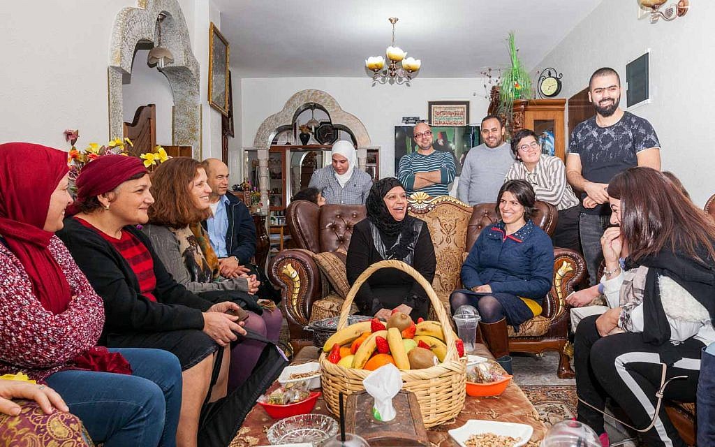 Participants of the Teachers' Lounge coexistence project at the home of an Arab participant in East Jerusalem. (Courtesy: Eyal Tagar)