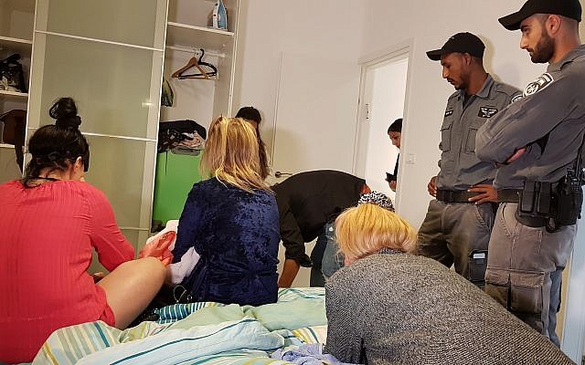 Police raid a brothel whose owners are suspected of human trafficking on August 28, 2018. (Israel Police)