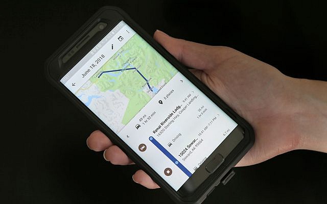 In this August 8, 2018, photo a mobile phone displays a user's travels using Google Maps in New York. (AP Photo/Seth Wenig)