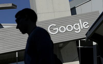 In this photo from November 12, 2015, fa man walks past a building on the Google campus in Mountain View, California. (AP Photo/Jeff Chiu, File)