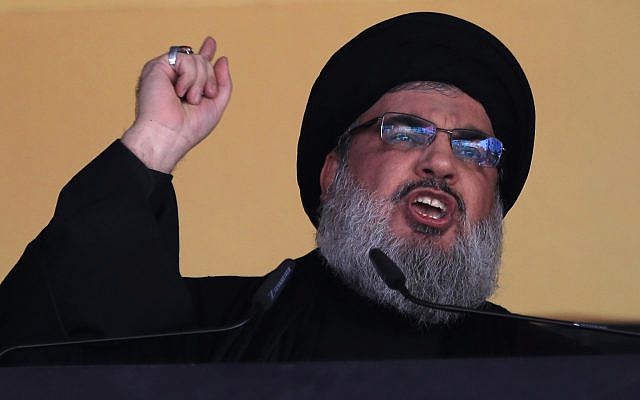 In this photo from October 24, 2015, Hezbollah leader Hassan Nasrallah addresses a crowd during the holy day of Ashoura, in a southern suburb of Beirut, Lebanon. (AP Photo/Hassan Ammar, File)