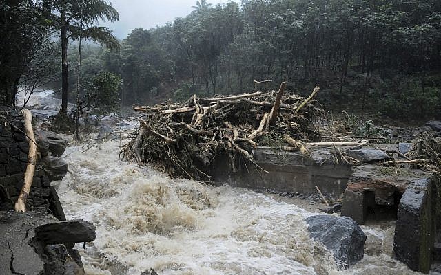 Water gushes out following heavy rain and landslide in Kozhikode, Kerala state, India, August 9, 2018. (AP Photo)