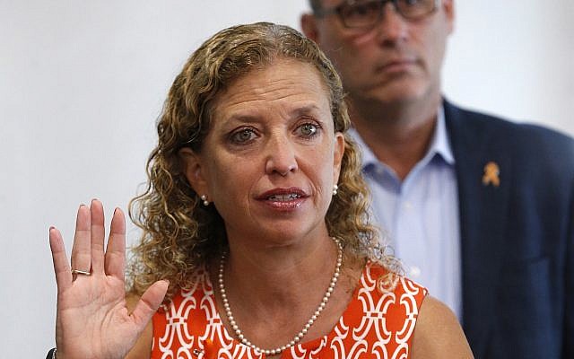 Rep. Debbie Wasserman Schultz, D-Fla., gestures as she speaks against the dangers of 3D-printed guns, along with Fred Guttenberg, rear, during a news conference at the Sunrise Police Department, August 16, 2018, in Sunrise, Florida. (AP Photo/Wilfredo Lee)