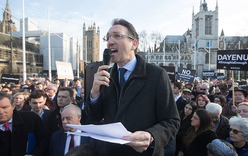 Jonathan Goldstein, chair of the Jewish Leadership Council, addresses the crowd in Parliament Square at the #EnoughIsEnough demonstration organized by UK Jewish leaders to protest anti-Semitism in the Labour party, March 2018. (Marc Morris/Jewish News)