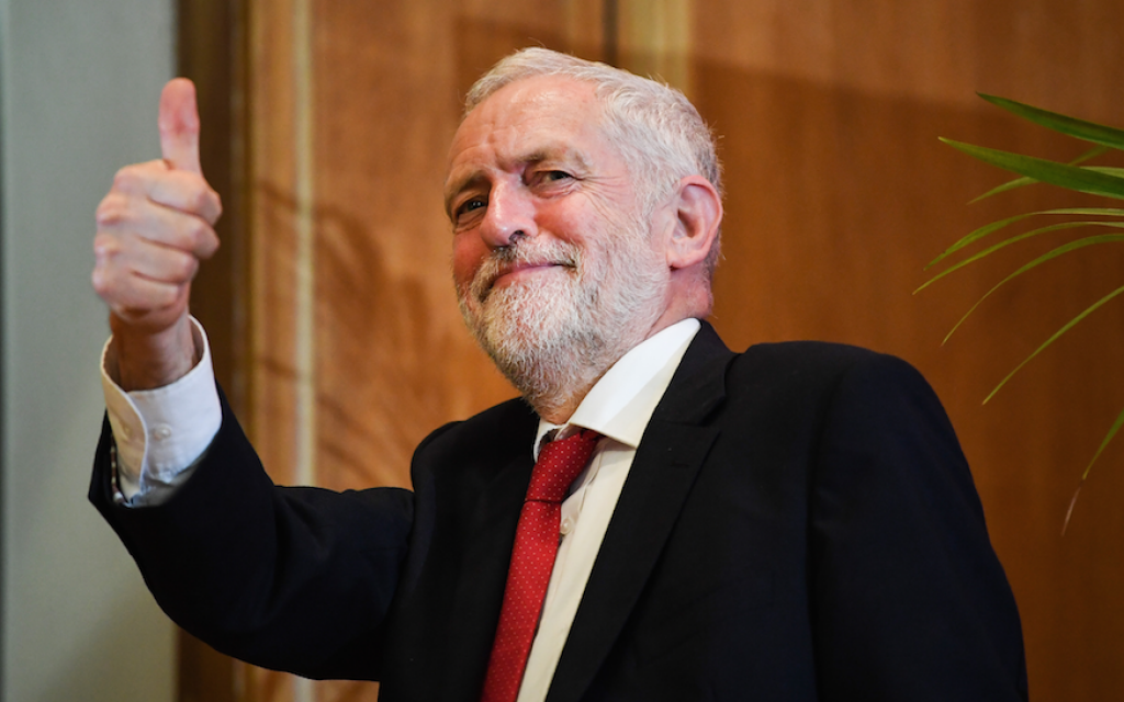 UK Labour Party leader Jeremy Corbyn leaves the stage after delivering a speech at Queens University in Belfast, Northern Ireland, May 24, 2018. (Jeff J. Mitchell/Getty Images via JTA)