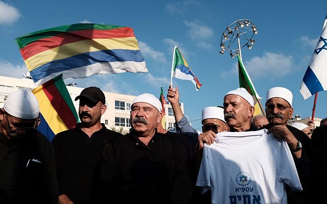 Activists and supporters of the Druze community in Israel protest against the national-state law recently passed by the Knesset for its ostensible discrimination against the community, at Rabin Square in Tel Aviv on August 4, 2018. (Tomer Neuberg/Flash90)