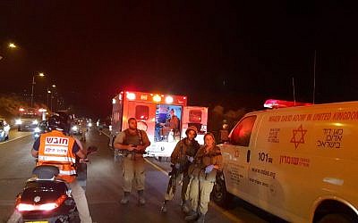 Soldiers and paramedics are seen at the scene where an Israeli woman was run over and killed by a Palestinian driver, near the northern West Bank settlement outpost of Havat Gilad on August 16, 2018. (Roi Hadi/Samaria Regional Council)