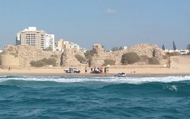 Medics attempt to resuscitate a man at an unauthorized beach in Ashdod on August 19, 2018. (Israel Police)