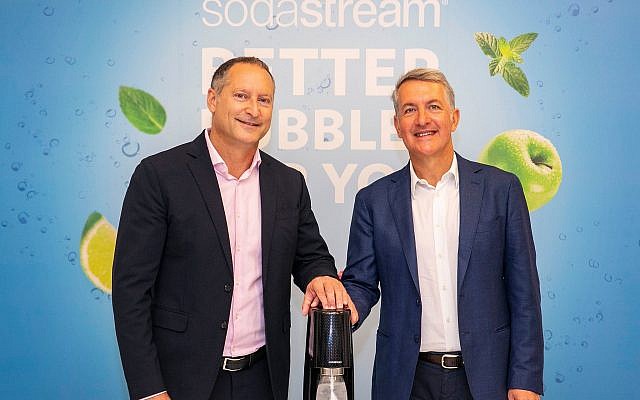 Newly elected CEO of PepsiCo, Ramon Laguarta (right), and SodaStream's Daniel Birnbaum at the signing of the acquisition deal, August 20, 2018, at SodaStream's offices in Israel (Lens Productions)