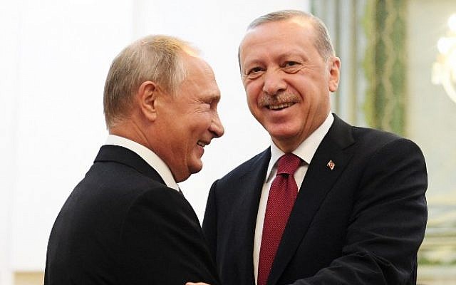Russia’s President Vladimir Putin (L) shakes hands with his Turkey’s counterpart Recep Tayyip Erdogan during their meeting in Tehran on September 7, 2018 (AFP/Pool/Kirill Kudryavtsev)