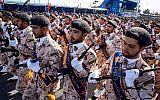 Illustrative: Members of Iran's Islamic Revolutionary Guard Corps (IRGC) march during the annual military parade, marking the anniversary of the outbreak of the devastating 1980-1988 war with Saddam Hussein's Iraq, in the capital Tehran, on September 22, 2018. (AFP/STR)