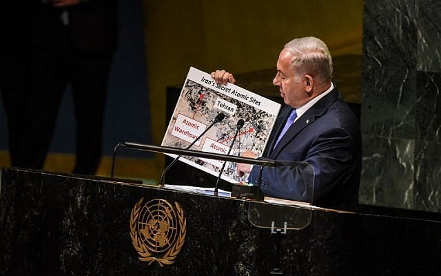 Benjamin Netanyahu holds up a placard of suspected Iranian atomic sites while delivering a speech at the United Nations during the United Nations General Assembly on September 27, 2018 in New York City. (Stephanie Keith/Getty Images/AFP)