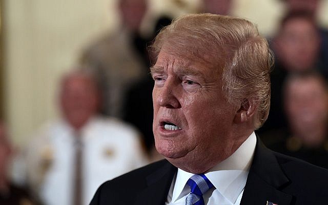 US President Donald Trump responds to a reporters question during an event with sheriffs in the East Room of the White House in Washington, September 5, 2018. (AP Photo/Susan Walsh)
