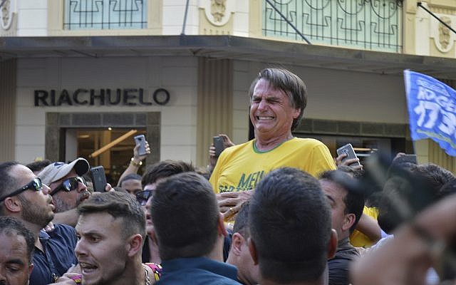 Presidential candidate Jair Bolsonaro grimaces right after being stabbed in the stomach during a campaign rally in Juiz de Fora, Brazil, Thursday, Sept. 6, 2018. (AP/Raysa Leite)