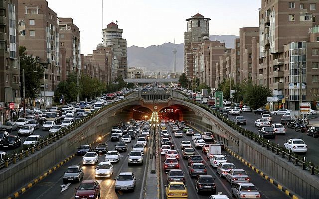 In this Monday, September 17, 2018 photo, vehicles are stuck in a traffic jam in southern Tehran, Iran. (AP Photo/Ebrahim Noroozi)