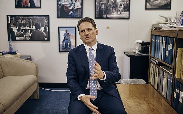 Head of the UN agency for Palestinian refugees, Pierre Krahenbuhl, speaks with a reporter during an interview with AP on September 27, 2018, in New York. (AP/Andres Kudacki)