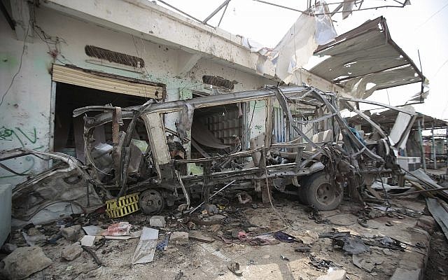 The wreckage of a bus remains at the site of a deadly Saudi-led coalition airstrike, in Saada, Yemen, August 12, 2018. (Hani Mohammed/AP)