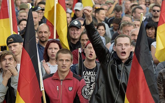 People attend a far-right demonstration in Chemnitz, eastern Germany, September 7, 2018 (AP Photo/Jens Meyer)