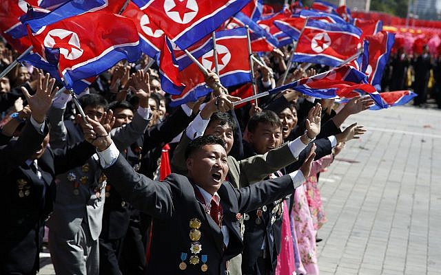 Participants cheer as they take part in a parade marking the 70th anniversary of North Korea's founding day in Pyongyang, North Korea, Sunday, Sept. 9, 2018. (AP Photo/Ng Han Guan)