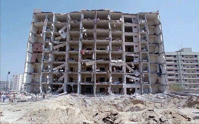This June 30,1996 photo, show a general view of the destroyed Khobar Towers and crater where a truck bomb exploded at a US military complex killing 19 Americans and injuring hundreds in Dhahran, Saudi Arabia. (AP Photo/Saleh Rifai)