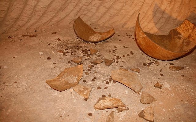 Smashed pottery and dozens of clay sealings found in one of the seven newly discovered rooms of a subterranean complex in the ancient Hellenistic-era city of Maresha, near Beit Guvrin. (Asaf Stern)