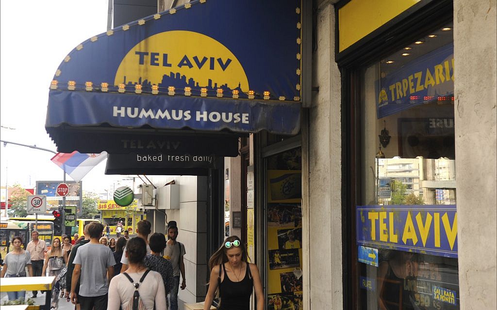 Israeli-owned Tel Aviv Hummus House attracts tourists along Belgrade’s Carice Milice Street, June 2018. (Larry Luxner/Times of Israel)